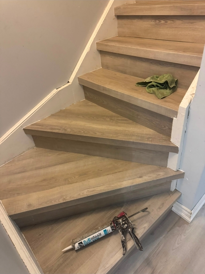 Staircase recladding with oak treads and risers in Hamilton Ontario